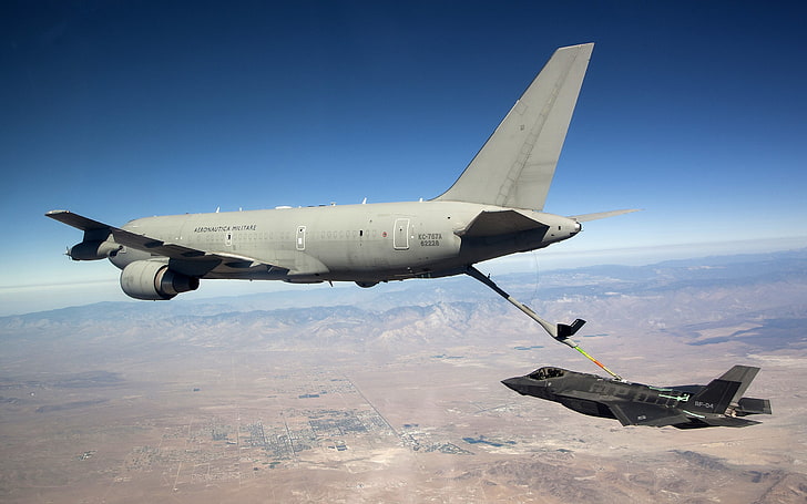 two gray fuel cargo plane and black Raptor fighter plane, Lockheed Martin F-35 Lightning II