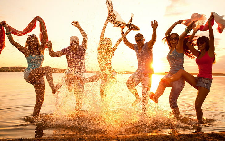 Party on beach, people jump shot photo and sunset view, youth