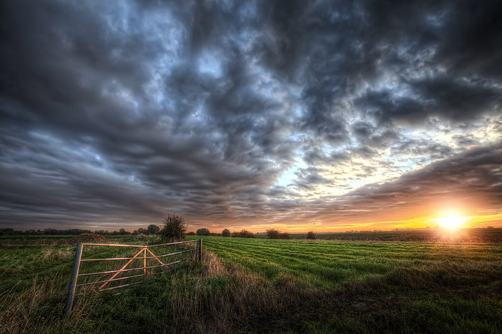 green and brown grass field, clouds, dark, sunset, yellow, gates, HD wallpaper