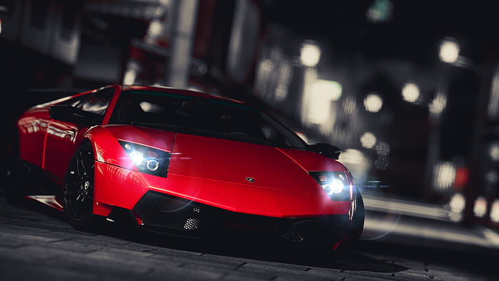 Red Lamborghini supercar front view, city night
