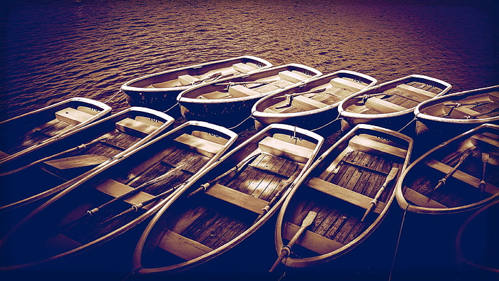 brown wooden jon boat lot, water, blue, dark, paddles, sea, no people