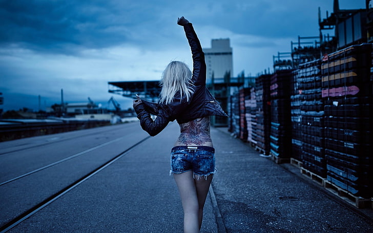 women's black jacket, jean shorts, tattoo, leather jackets, platinum blonde
