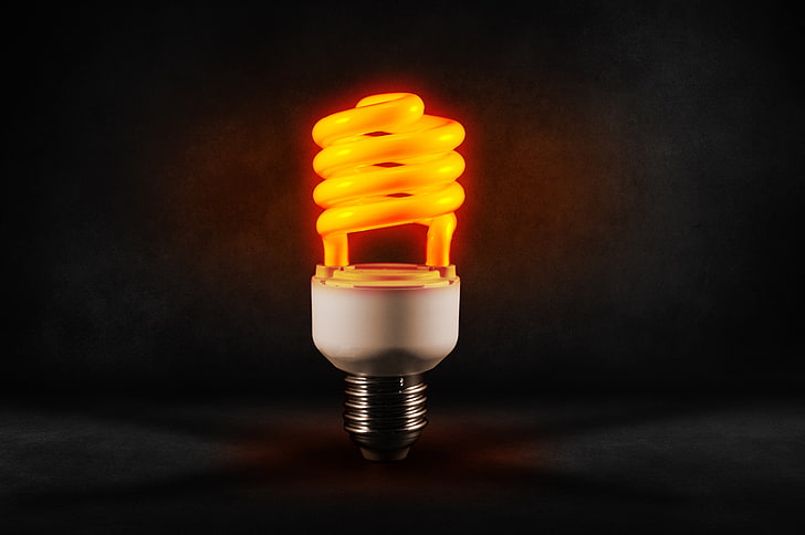 yellow CFL light bulb, lamp, spiral, energy saving, studio shot