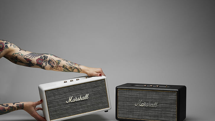 person holding Marshall guitar amplifier, Marshall Stanmore, review