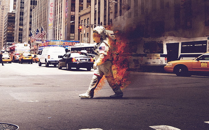 men's grey spacesuit, astronaut on fire crossing the street, cityscape