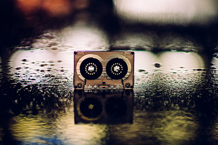 cassette, wet street, reflection
