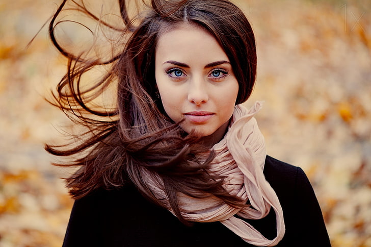 women's white scarf, selective focus photography of woman wearing brown scarf