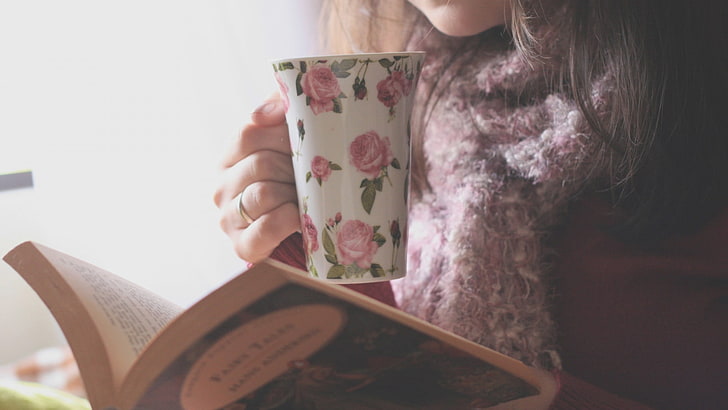 white and pink floral ceramic mug, tea, books, scarf, introvert