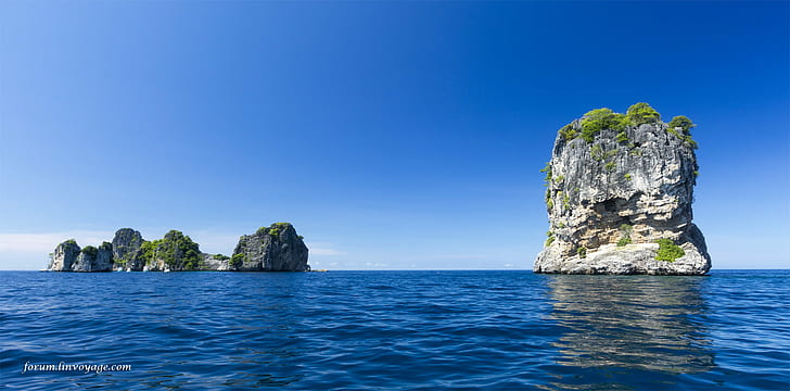 photo of island on ocean during day tiome, yacht  sail, sail  boat