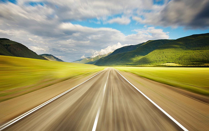 motion blur photo of road near hills, sky, cloud - sky, transportation