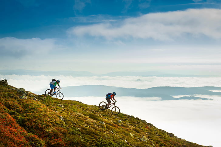 two mountain bikers on top of hill during day time, trysil, trysil