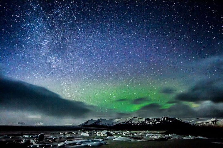 Northern Lights over snow covered mountain during night, iceland, iceland