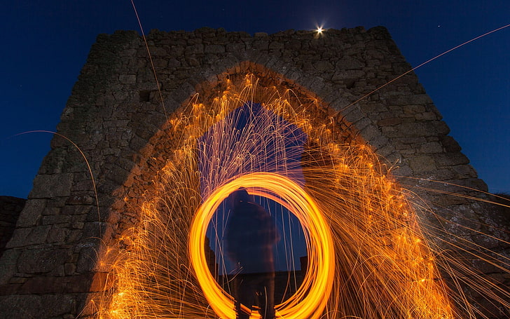 steel wool photography of concrete wall, long exposure, night