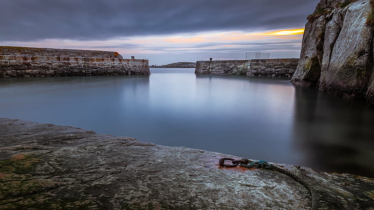 body of water surrounded with gray concrete wall, Dalkey, sunrise
