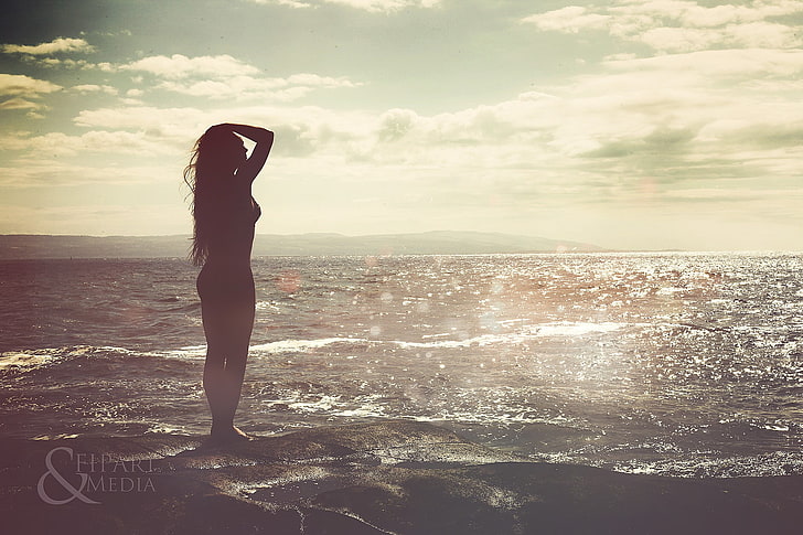 silhouette of woman standing near beach, sea, water, long hair