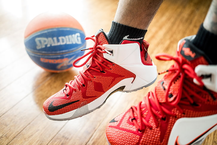 pair of white-and-red Nike basketball shoes, lebron, spalding