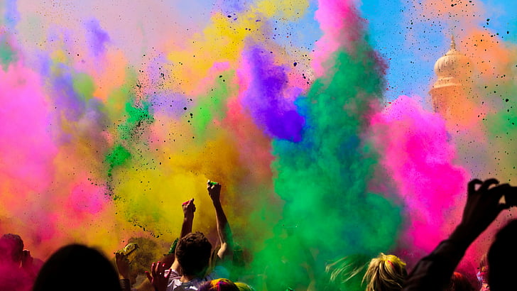 people throwing pink, green, and blue Holi powders, Holi Festival Of Colours