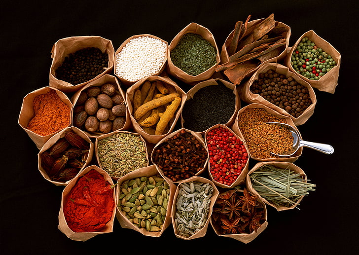 assorted herbs, spices, seasonings, additives, bags, black background