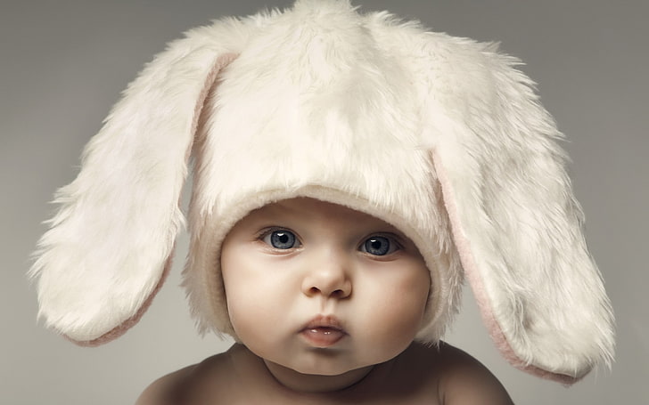 baby's white rabbit-themed aviator hat, face, portrait, childhood