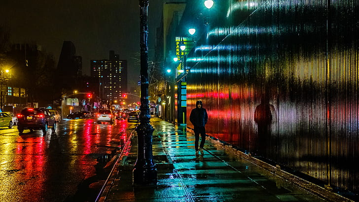 photo of man walking across the alley at night, east side, east side