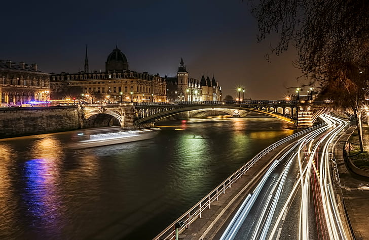 time lapse photography of concrete road near river and bridge with moving cars at night time, paris, seine, paris, seine