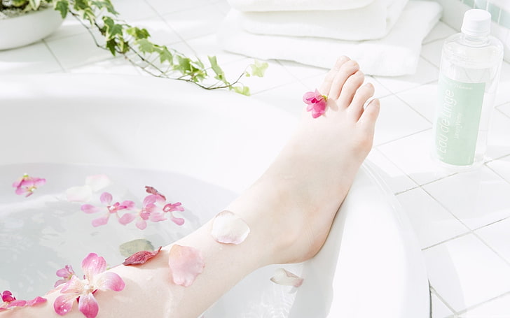 woman's right foot, bath, aromatherapy, petals, body Care, women