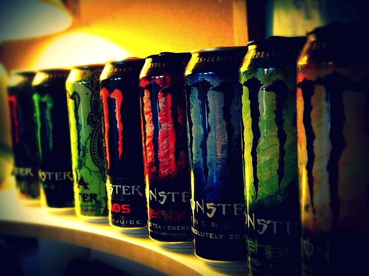 Monster energy drink can lot, multi colored, indoors, in a row