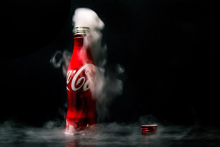 red Coca-Cola bottle, black background, studio shot, smoke - physical structure