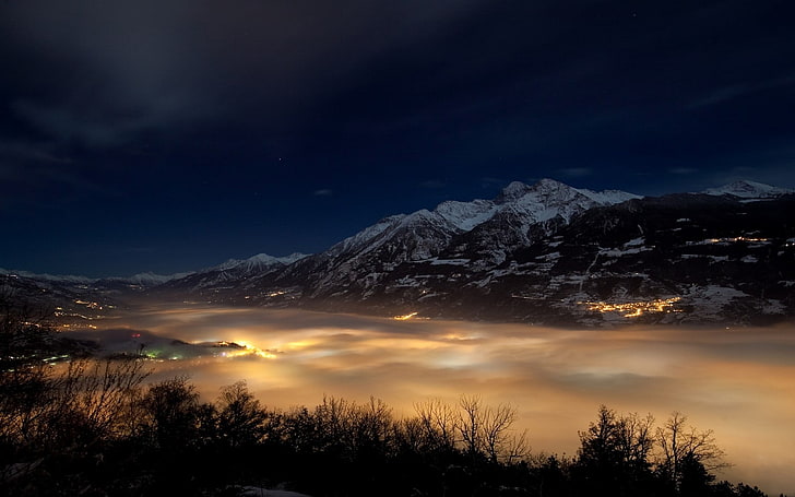 mountain rage under sea of clouds view during night time, nature