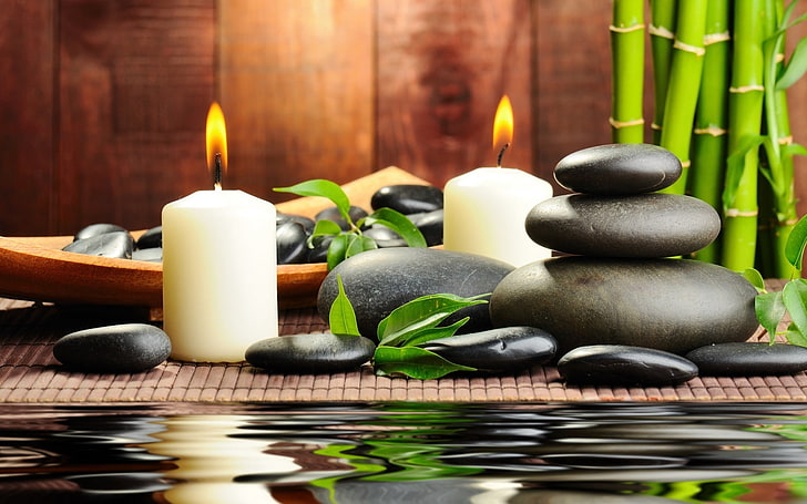 two white candles, stones, aromatherapy, spa, water, bamboo, massage
