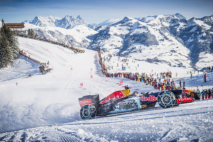 Redbull racing snow car near people on snow mountain, Formula 1