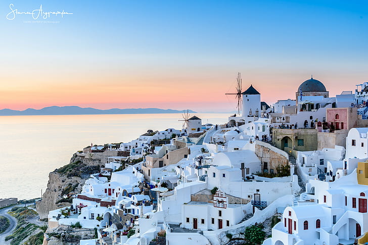Premium Photo  Fantasy concept showing a santorini greece iconic blue and  white buildings on a cliff by the sea