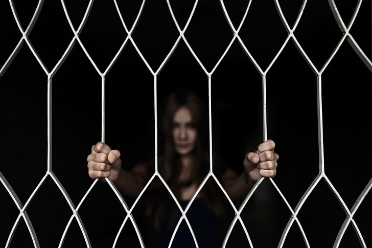 women, hands, face, fence, grid, one person, prison cell, trapped