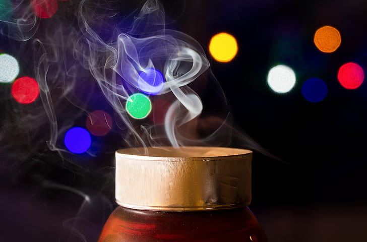 bokeh light photography of smoke on brass-colored tin can, Smoking