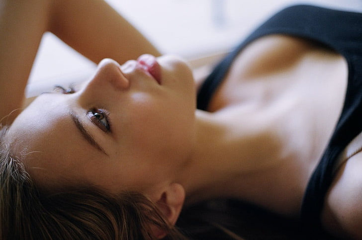 women's black top, Alexis Ren, model, depth of field, face, lying down