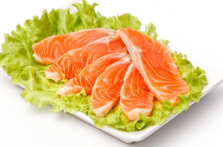 sliced of raw meat on lettuce, fish, pieces, cabbage, plate, white background