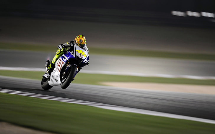 man riding blue and yellow sports motorcycle, racing, Valentino Rossi