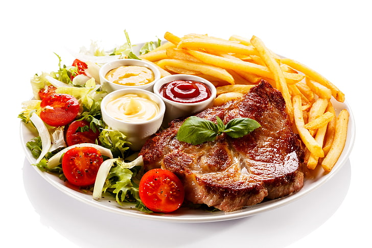 grilled meat with French fries and sauce, tomatoes, ketchup, potatoes