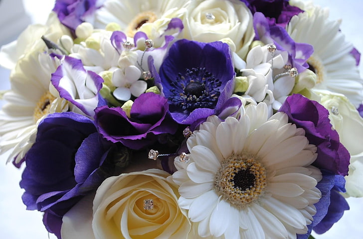 white Gerbera daisy flowers, purple anemone flowers, yellow and white rose flowers, and purple tulip flowers bouquet