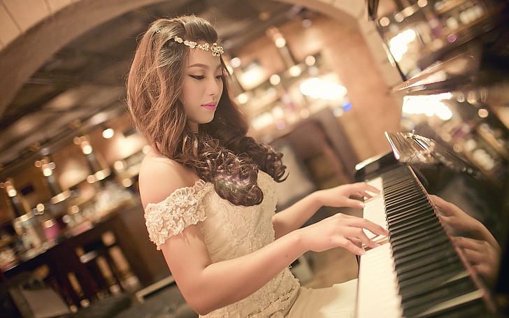 Pretty asian girl play piano