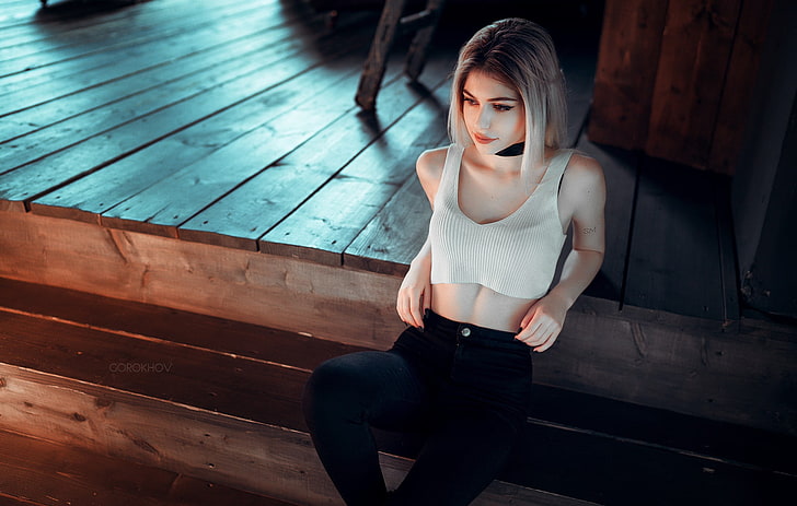 woman in white sports bra and black pants illustration, woman wearing white crop-top and black leggings sitting on stairs