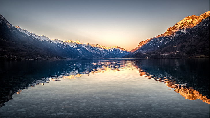 photo of lake surrounded by mountains during golden hour, Lake Brienz