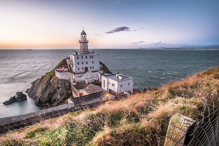 photo of lighthouse beside white painted building, baily lighthouse, dublin, ireland, baily lighthouse, dublin, ireland