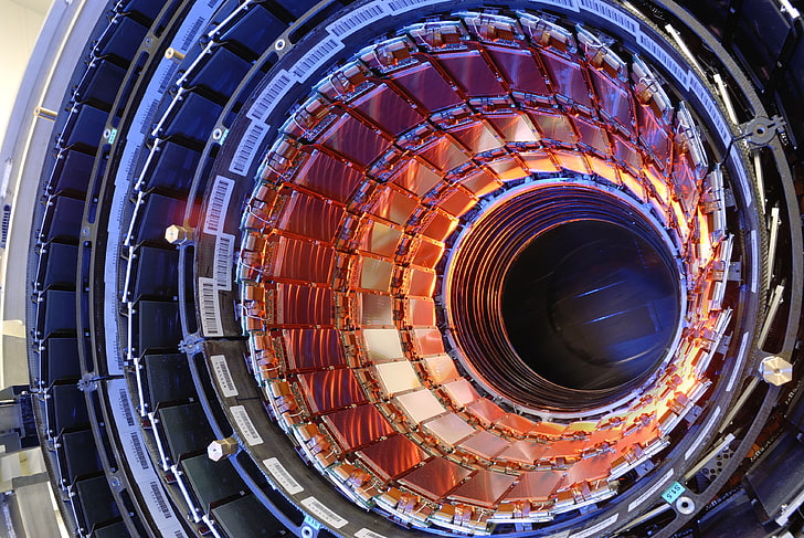 blue and orange machine photo, hadron collider, accelerator, particles
