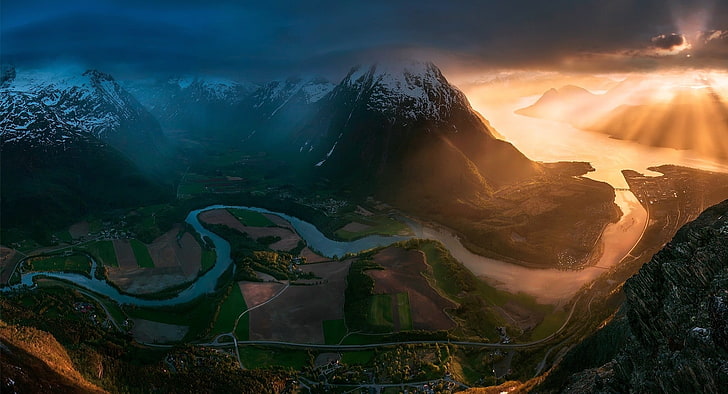mountain with river flowing during golden hour, sunset, Norway