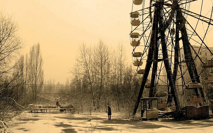 sepia photography of person standing near ferris wheel, Chernobyl