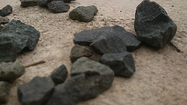 black and gray stone fragment, stones, sand, solid, rock, rock - object