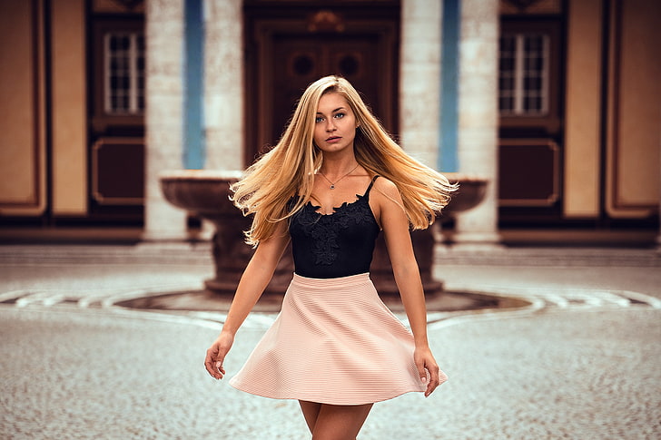women's black camisole and pink mini skirt, blonde, necklace