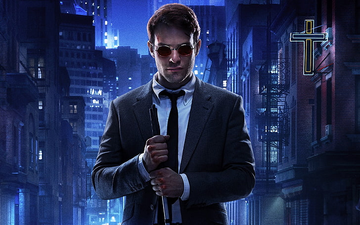 man wearing suit between high rise building digital wallpaper