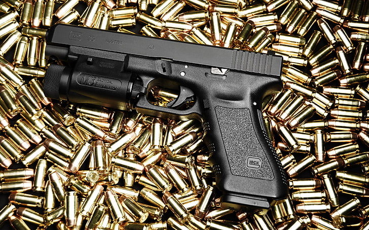 black semiautomatic pistol and brass-colored bullet shell lot, HD wallpaper